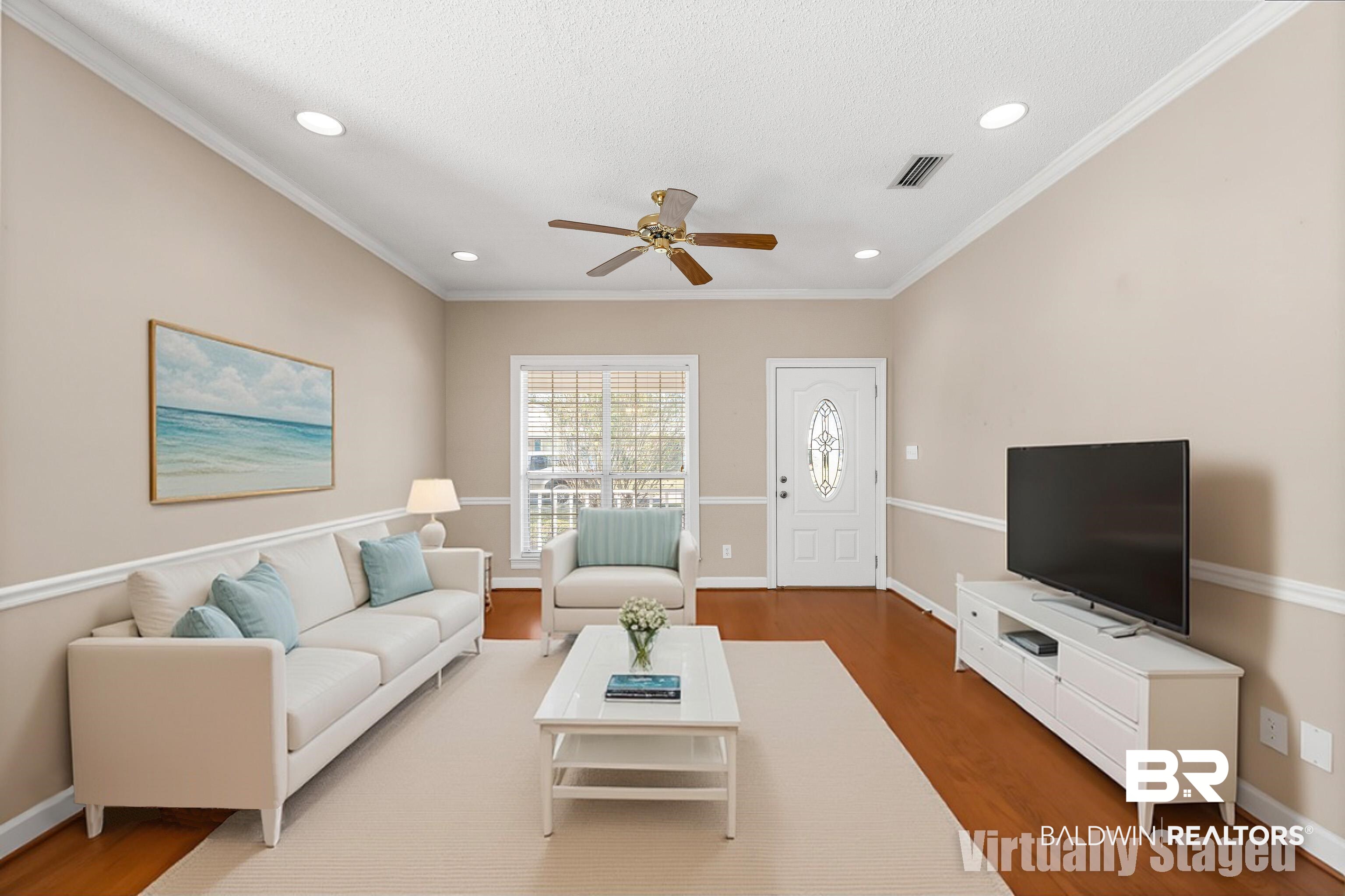 27 Cottage Drive Fairhope, AL 36532 - Photo 6 of 33 Virtually staged Living room with crown molding, wood finished floors, ceiling fan, and recessed lighting
