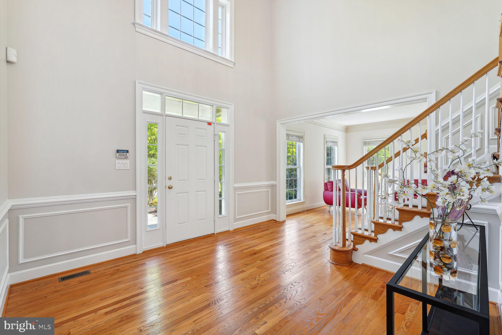 Two Story Foyer & Hardwoods Throughout
