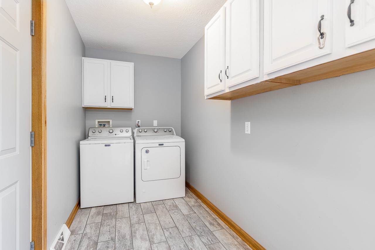 4661 North Marrill Road Byron, IL 61010 - Photo 14 of 39 a utility room with dryer and washer