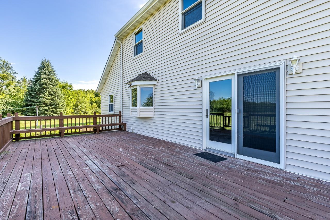 4661 North Marrill Road Byron, IL 61010 - Photo 25 of 39 a view of a house with a deck