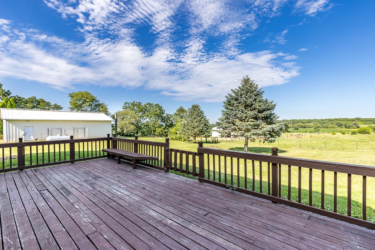 4661 North Marrill Road Byron, IL 61010 - Photo 26 of 39 a view of a balcony with wooden floor