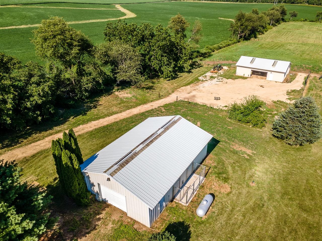 4661 North Marrill Road Byron, IL 61010 - Photo 29 of 39 a view of a yard with plants