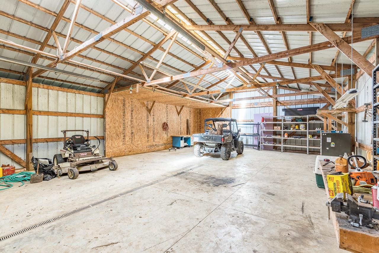 4661 North Marrill Road Byron, IL 61010 - Photo 30 of 39 a view of garage with a table and chairs