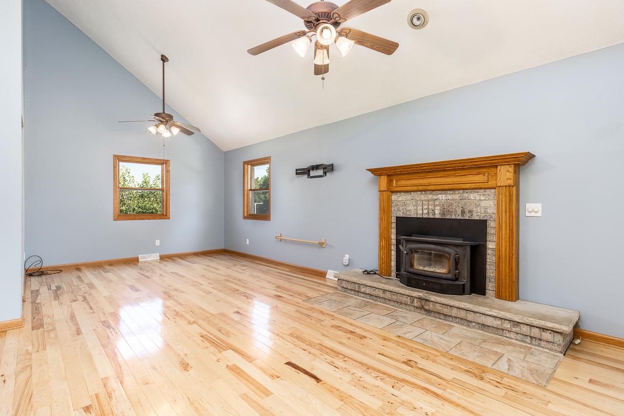 4661 North Marrill Road Byron, IL 61010 - Photo 3 of 39 a view of an empty room with a fireplace and a window
