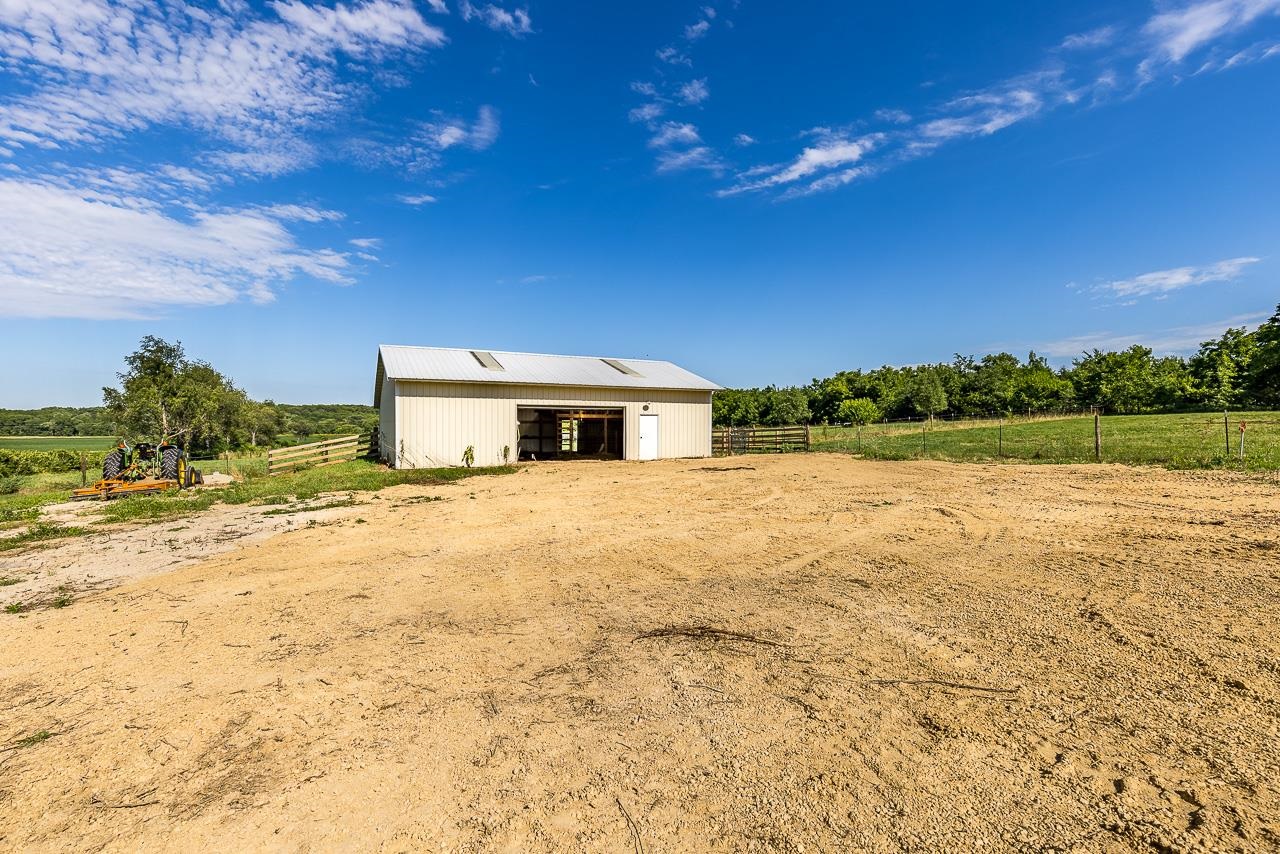 4661 North Marrill Road Byron, IL 61010 - Photo 32 of 39 a house view with a swimming pool