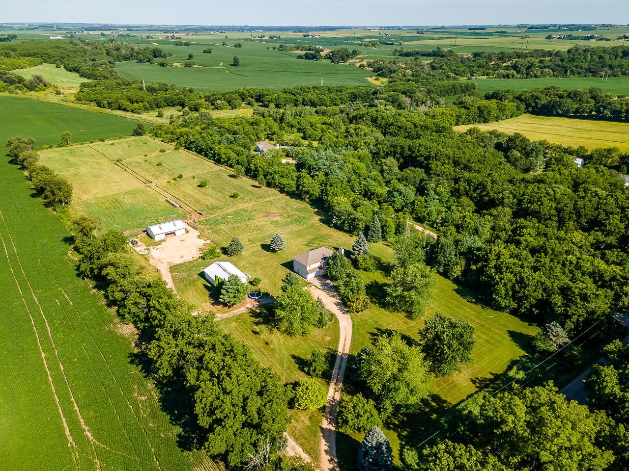 4661 North Marrill Road Byron, IL 61010 - Photo 37 of 39 an aerial view of a residential houses with outdoor space and trees all around