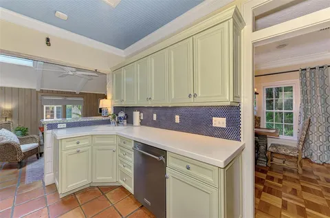 a living room with furniture wooden floor and a flat screen tv