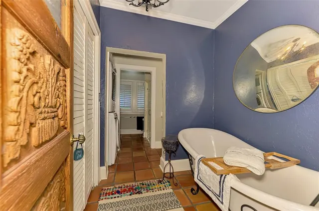 a bathroom with a granite countertop toilet sink and mirror