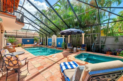 a view of a backyard with sitting area