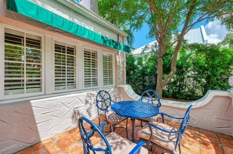a bedroom with furniture and a chandelier