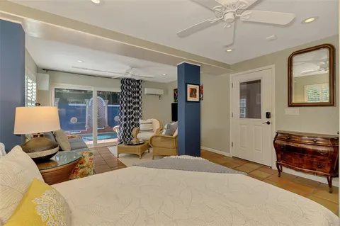 a bathroom with a granite countertop toilet a sink and a mirror