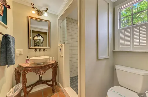 a view of a house with backyard sitting area and garden