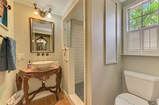 a view of a house with backyard sitting area and garden