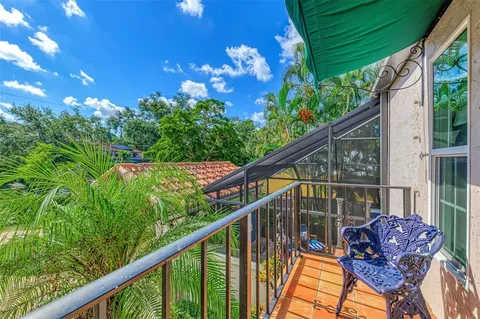 a bedroom with furniture fireplace and flat screen tv