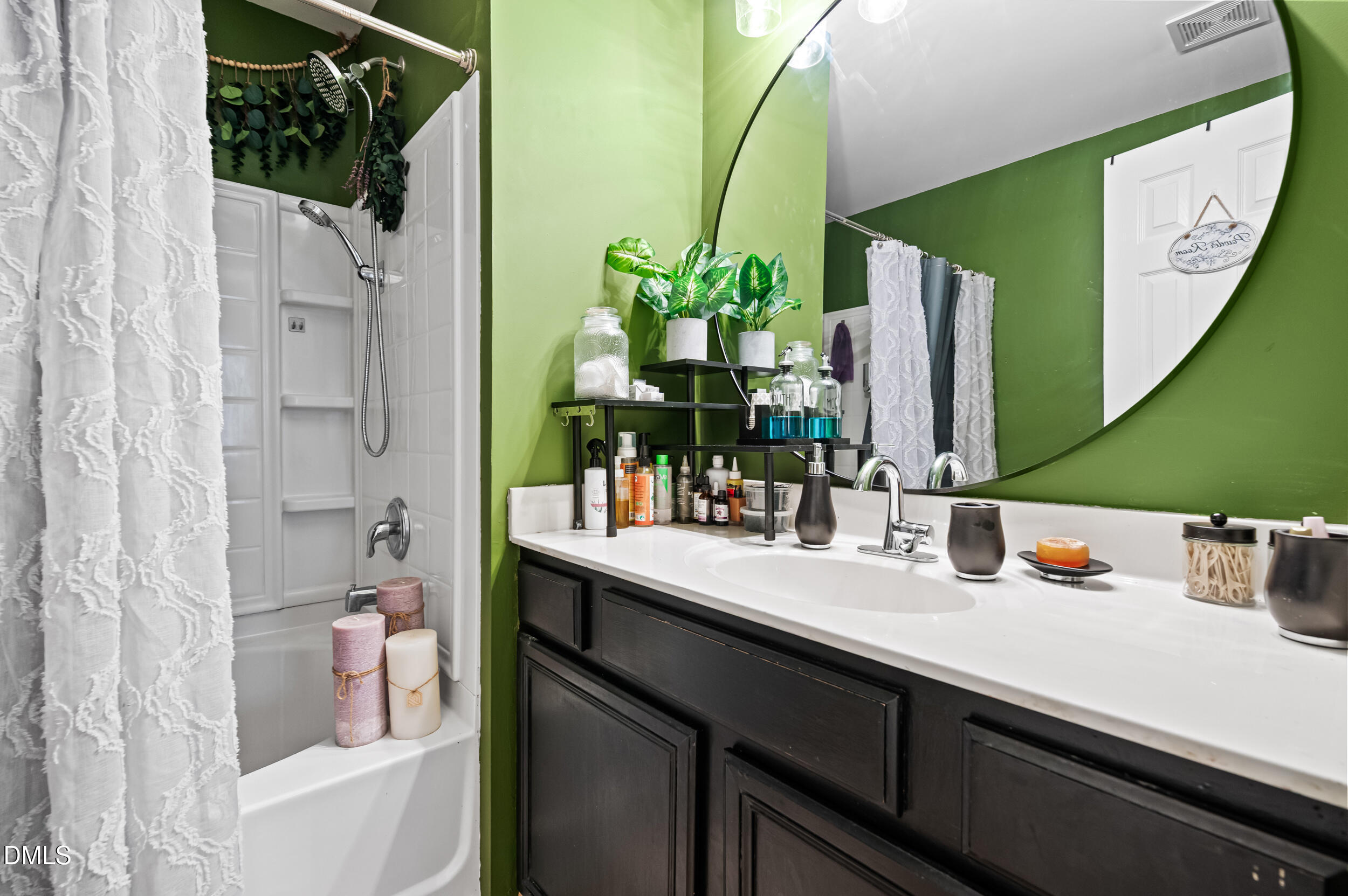 2944 Casona Way Raleigh, NC 27616 - Photo 15 of 24 a bathroom with a sink and a mirror