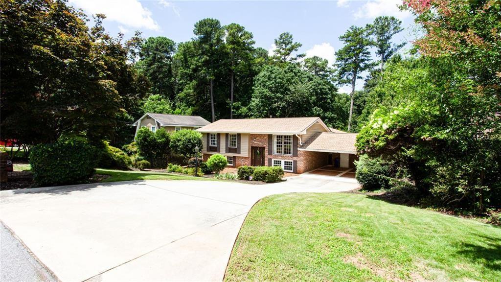 2814 Goodfellows Road Tucker, GA 30084 - Photo 3 of 46 a view of a house with a yard and tree s