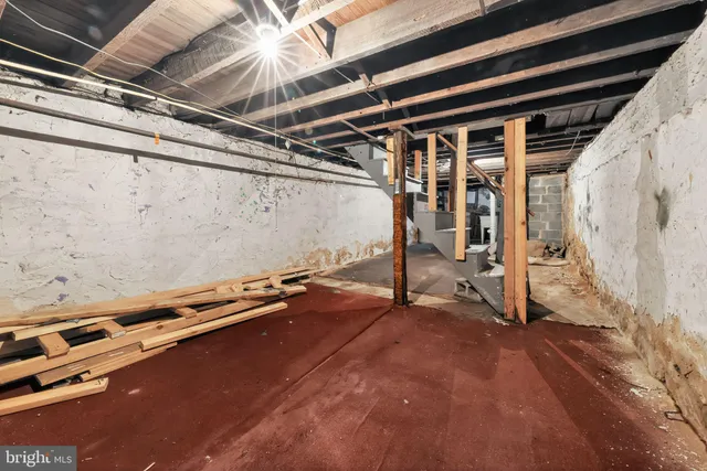 a view of an empty room with windows