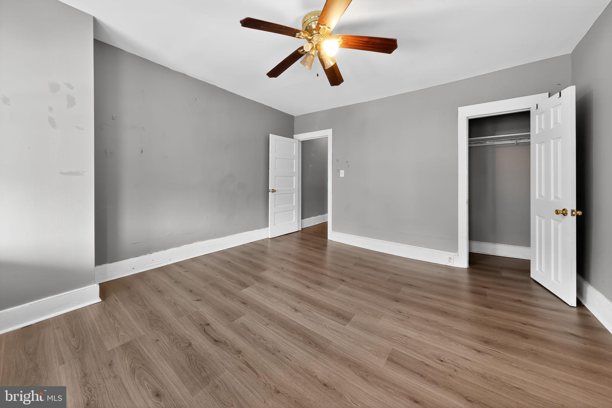 11 East 24th Street Wilmington, DE 19802 - Photo 25 of 31 an empty room with wooden floor ceiling fan and window