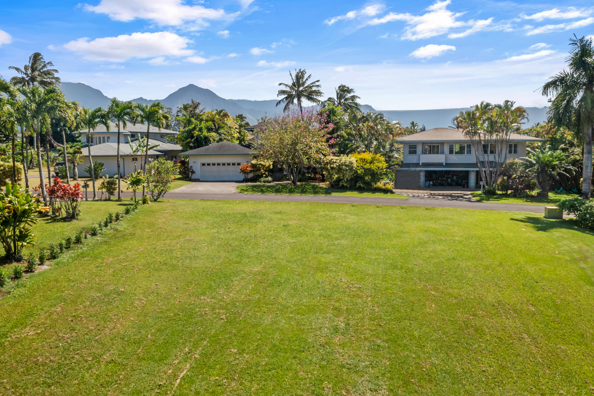 4890 Akai Road Princeville, HI 96722 - Photo 9 of 15 a view of a house with a swimming pool and a yard