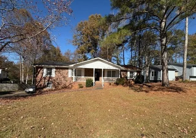 a blue bench sitting in front of a building