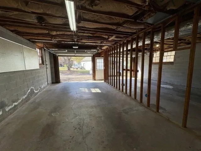 a view of a room with wooden walls