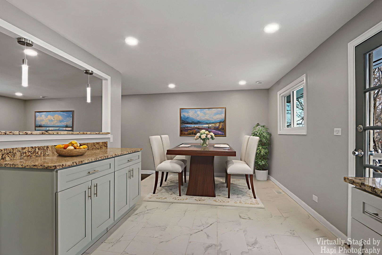 1835 West Weathersfield Way Schaumburg, IL 60193 - Photo 12 of 54 a view of a kitchen with kitchen island granite countertop lots of counter top space and dining table