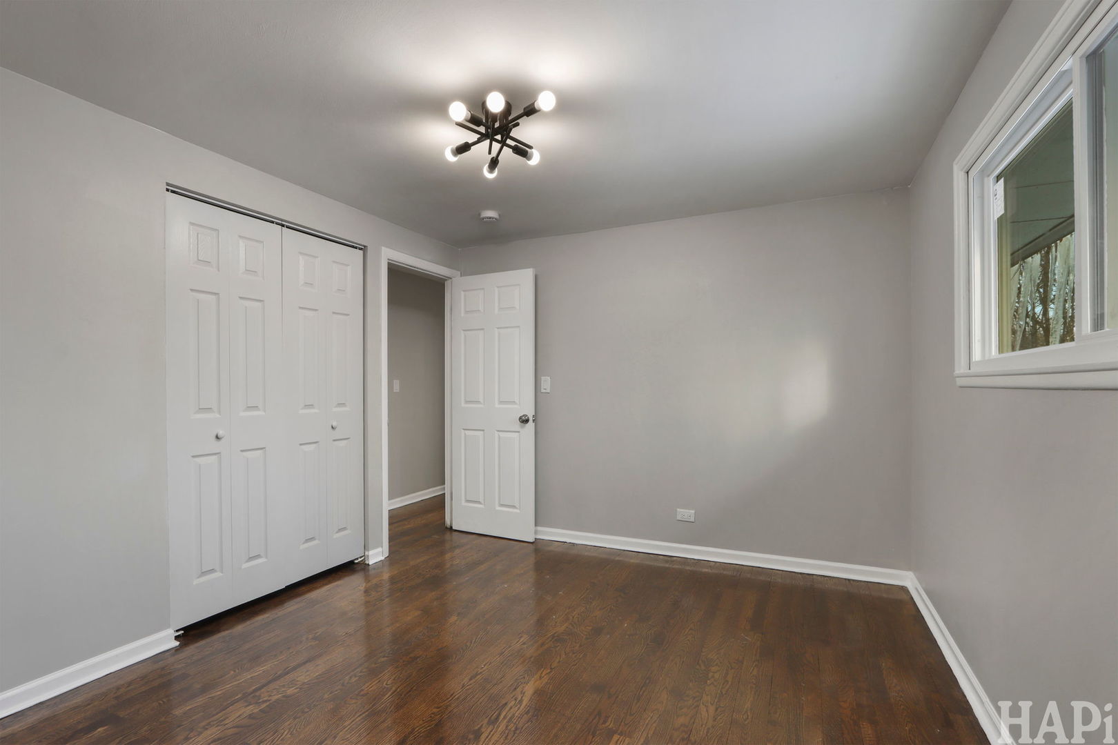 1835 West Weathersfield Way Schaumburg, IL 60193 - Photo 20 of 54 a view of an empty room with a window and wooden floor