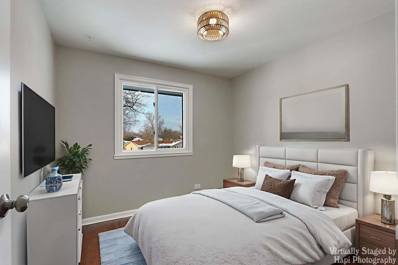 1835 West Weathersfield Way Schaumburg, IL 60193 - Photo 27 of 54 a bedroom with a bed and a flat screen tv