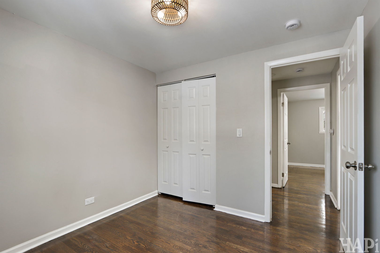 1835 West Weathersfield Way Schaumburg, IL 60193 - Photo 29 of 54 an empty room with wooden floor and mirror