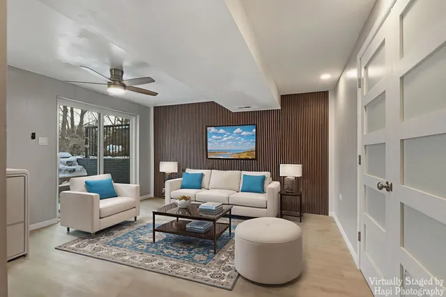 a living room with furniture and a rug