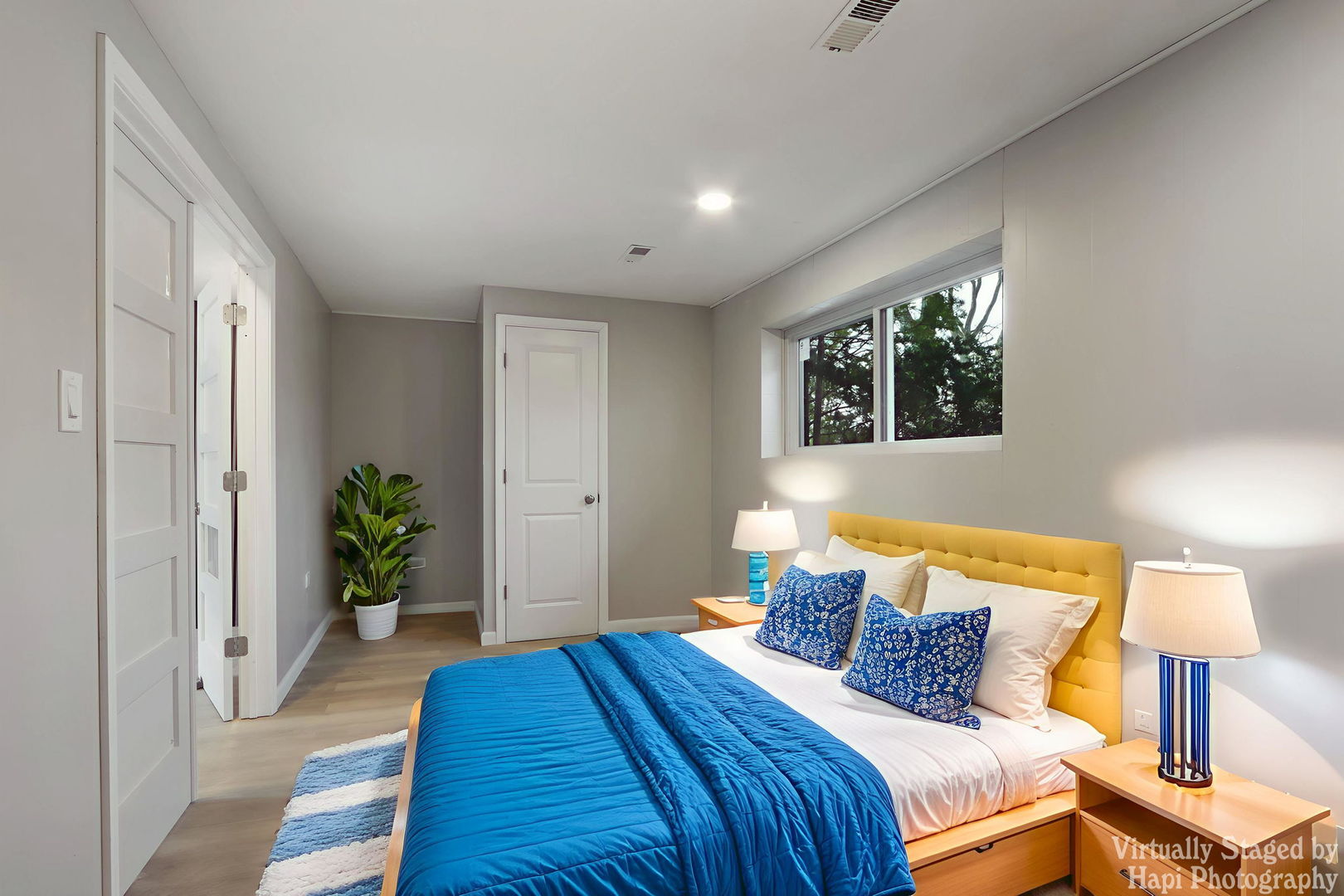 1835 West Weathersfield Way Schaumburg, IL 60193 - Photo 38 of 54 a bedroom with a bed and a lamp