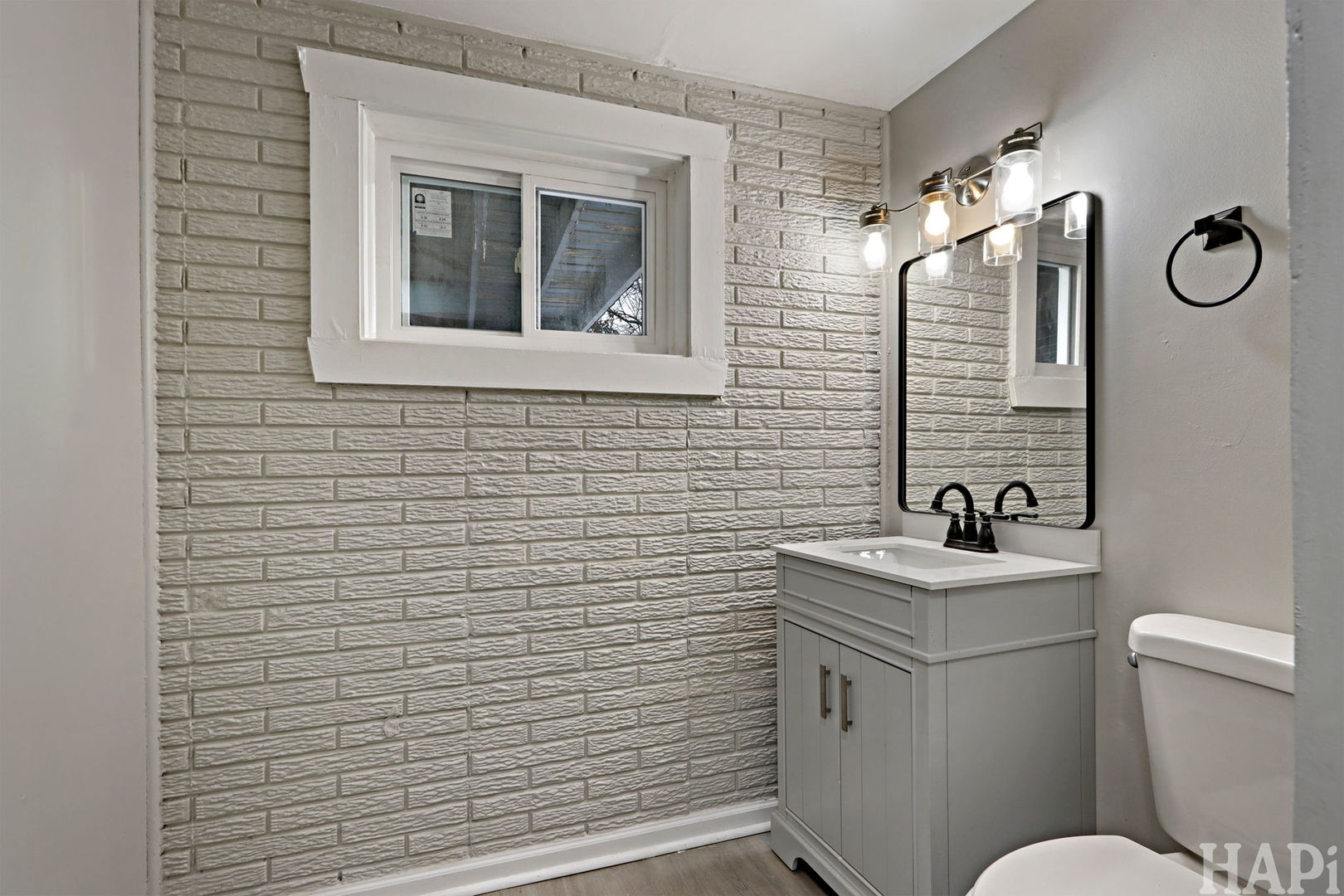 1835 West Weathersfield Way Schaumburg, IL 60193 - Photo 42 of 54 a bathroom with a toilet sink vanity and mirror