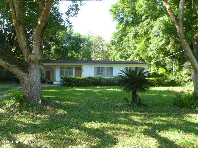 9752 Cunningham Road Jacksonville, FL 32246 - Photo 2 of 12 a view of a house with a backyard