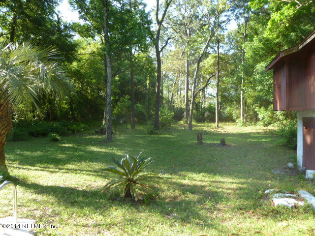 9752 Cunningham Road Jacksonville, FL 32246 - Photo 6 of 12 a view of a trees in a yard