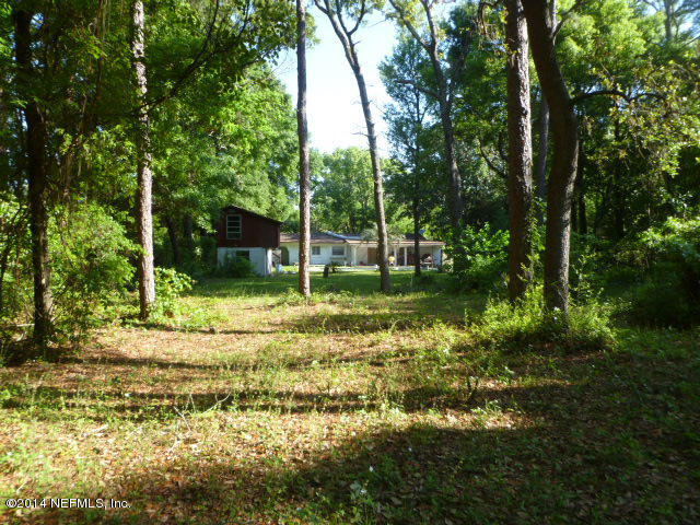 9752 Cunningham Road Jacksonville, FL 32246 - Photo 8 of 12 a view of a tree in a yard