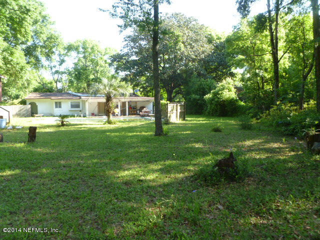 9752 Cunningham Road Jacksonville, FL 32246 - Photo 9 of 12 a house view with a sitting space and garden