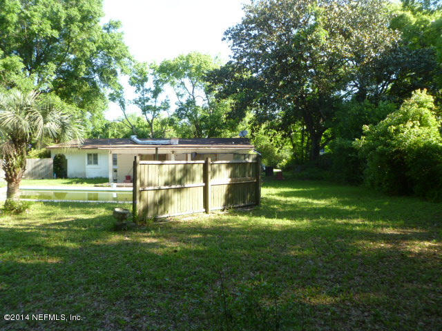 9752 Cunningham Road Jacksonville, FL 32246 - Photo 10 of 12 a view of backyard with swimming pool and green space