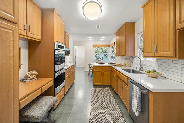 a bedroom with a bed and a glass walk in closet