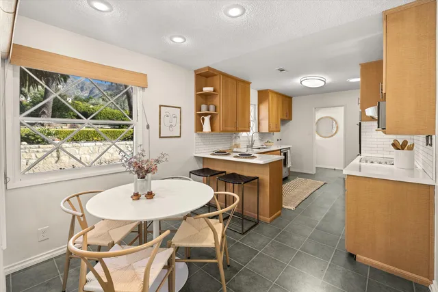 a view of a backyard of the house