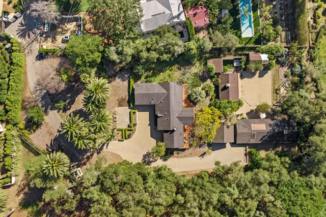 a spacious bedroom with a bed and a large window