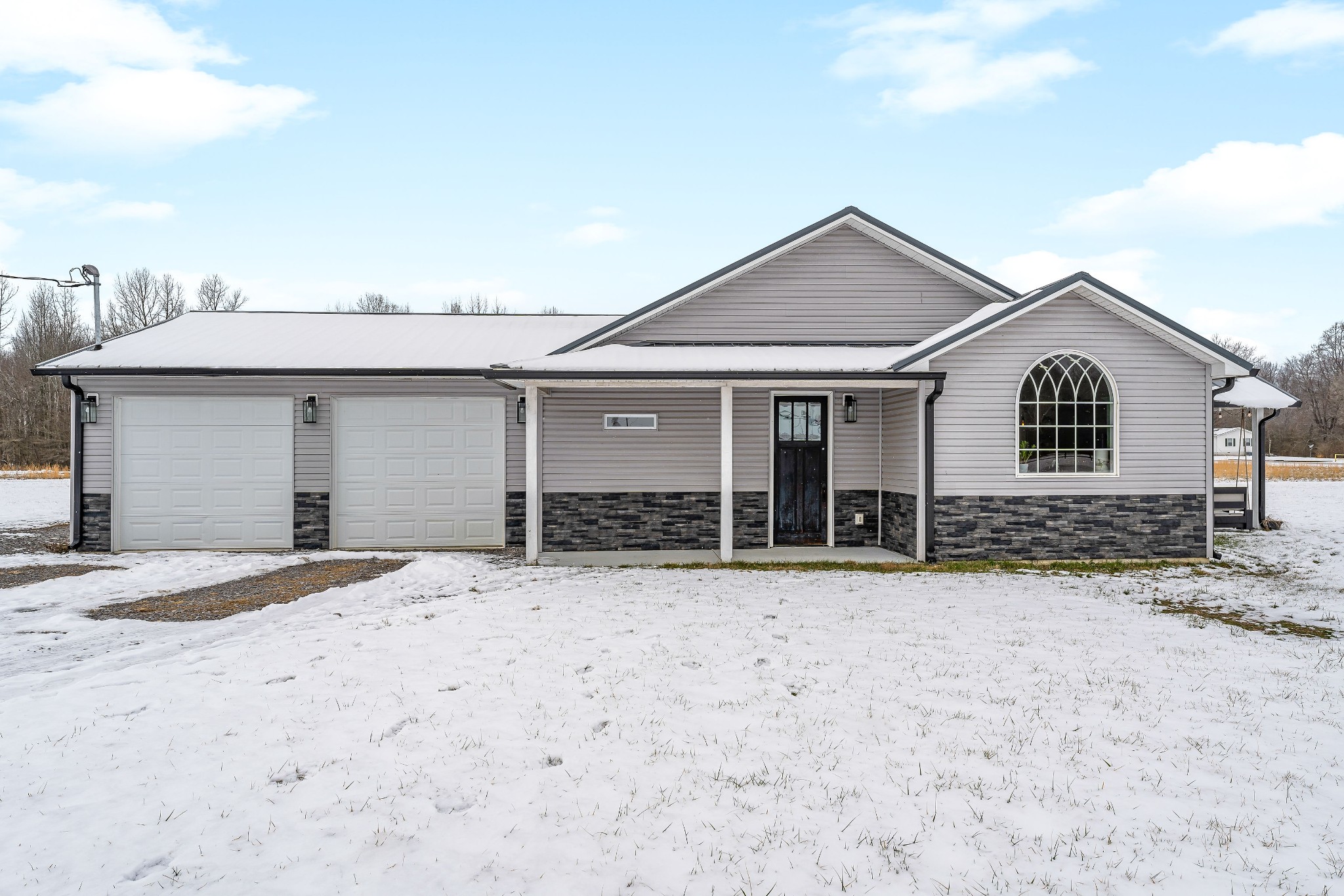 241 Ferrells Loop Road Manchester, TN 37355 - Photo 1 of 45 a front view of a house with a garden and yard