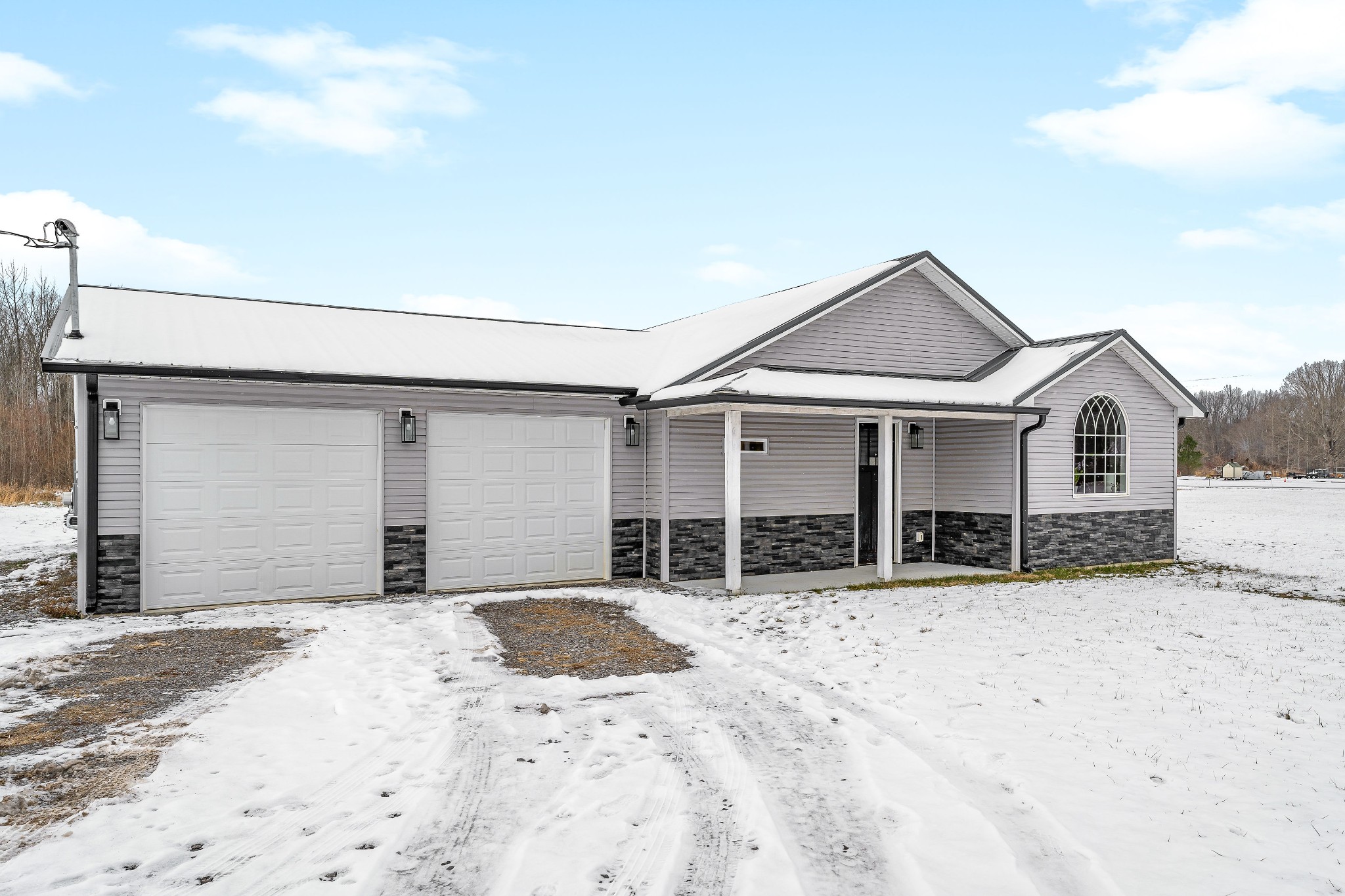241 Ferrells Loop Road Manchester, TN 37355 - Photo 42 of 45 a front view of a house with a yard and garage