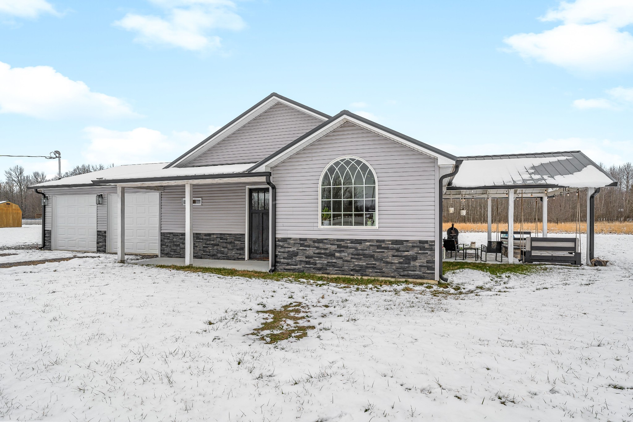 241 Ferrells Loop Road Manchester, TN 37355 - Photo 43 of 45 a view of a house with a yard covered in snow
