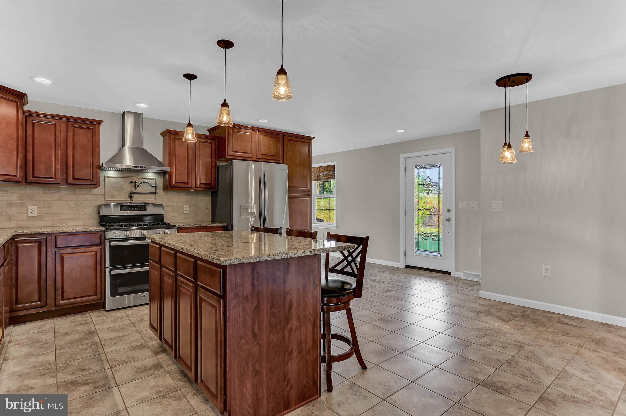 40 Locust Point Road Manchester, PA 17345 - Photo 26 of 66 GAS RANGE, POT FILLER & STAINLESS EXHAUST HOOD