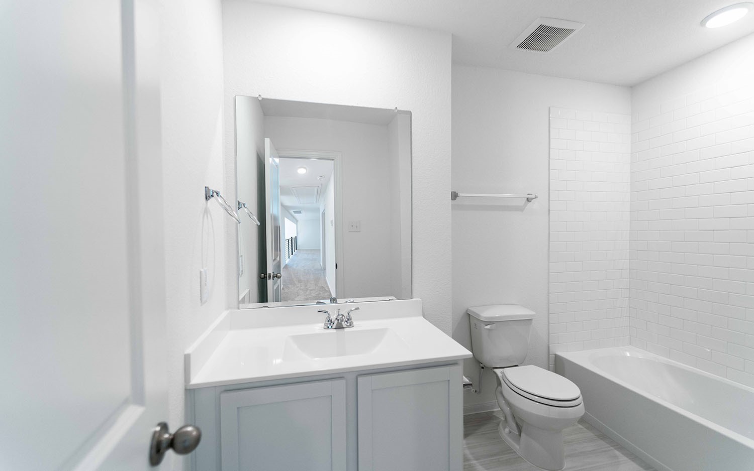 425 Monarch Trail Huntsville, TX 77340 - Photo 16 of 19 a bathroom with a toilet sink and mirror