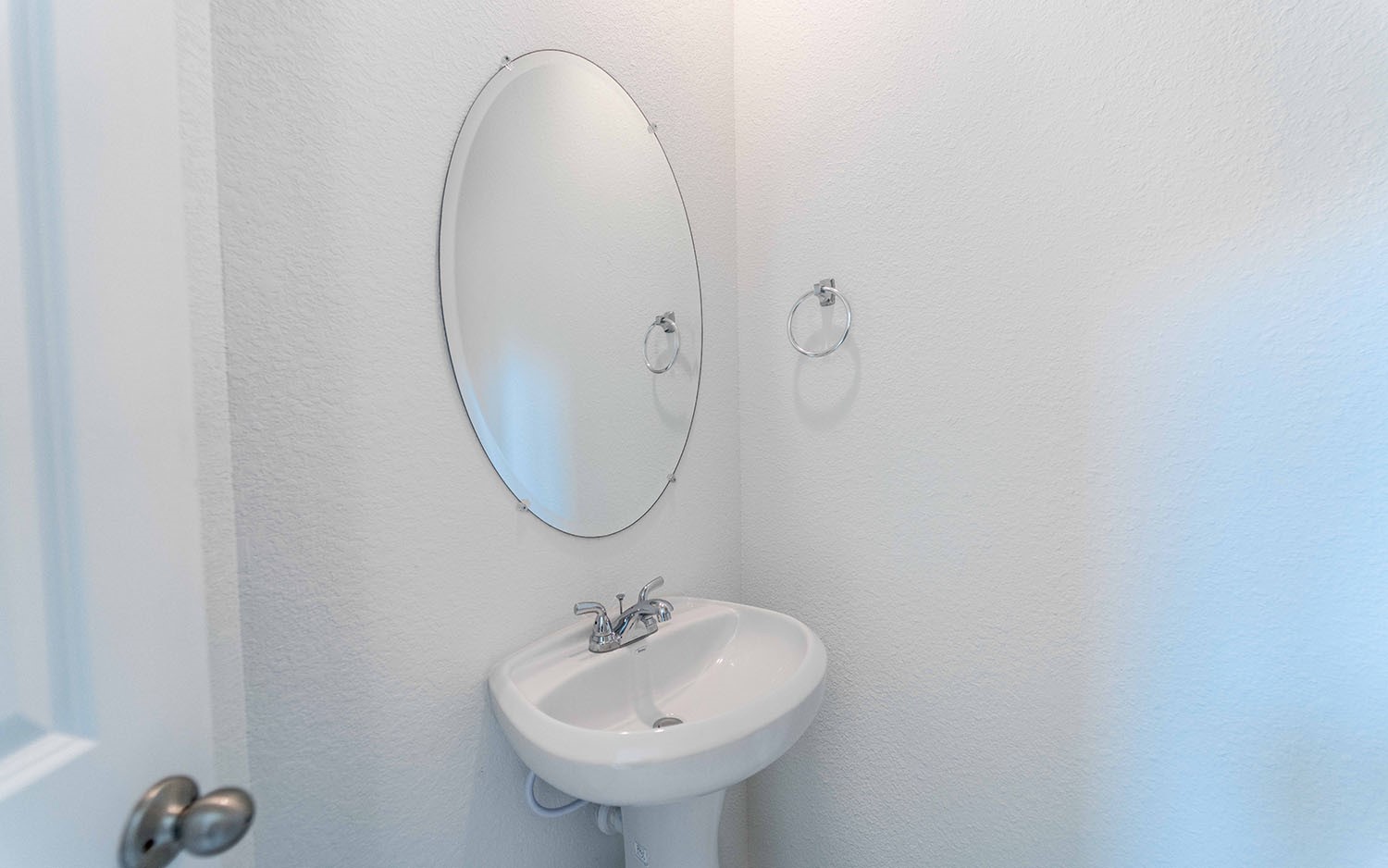 425 Monarch Trail Huntsville, TX 77340 - Photo 18 of 19 a bathroom with a sink and a mirror