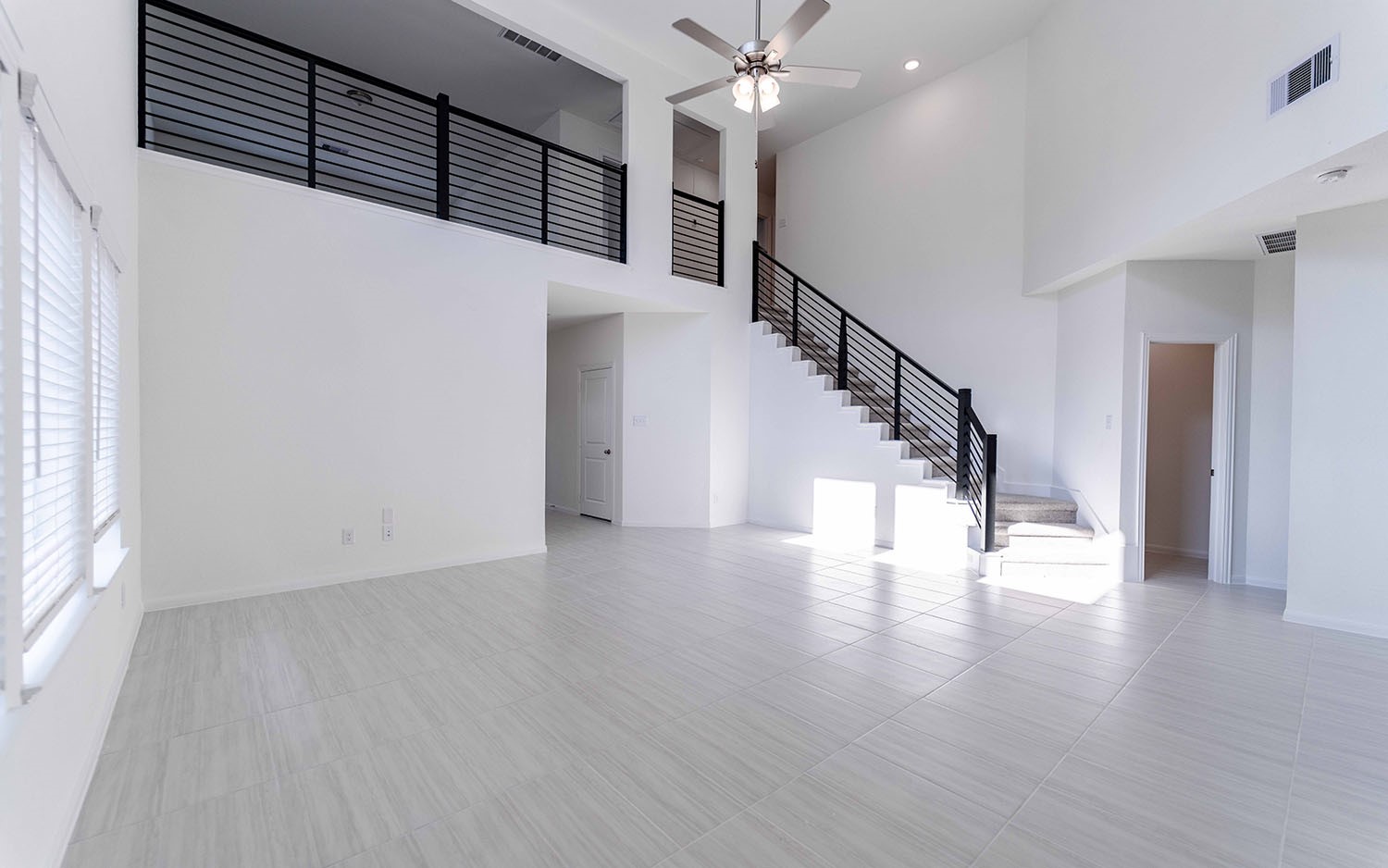 425 Monarch Trail Huntsville, TX 77340 - Photo 4 of 19 a view of staircase with white walls and a window