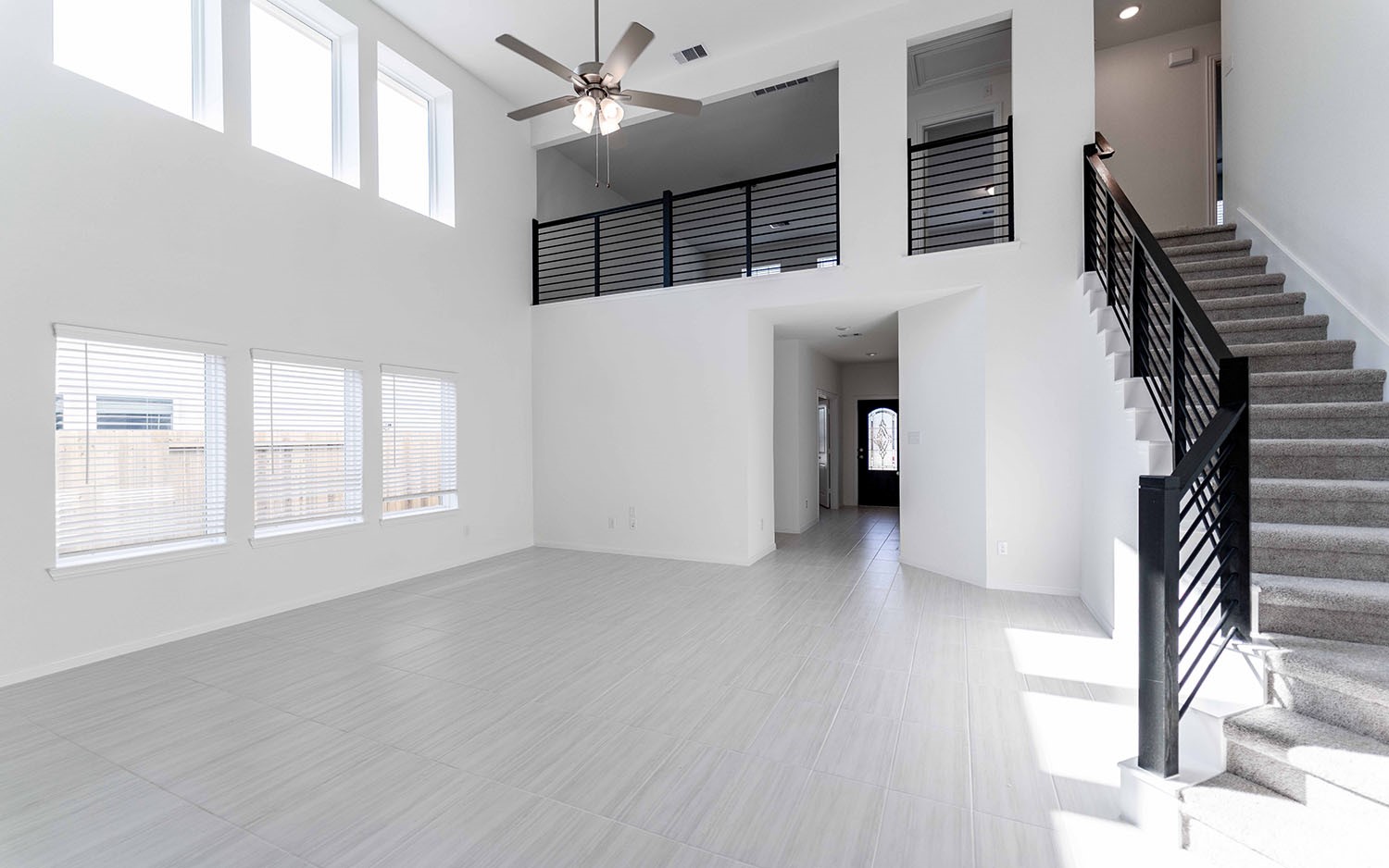 425 Monarch Trail Huntsville, TX 77340 - Photo 5 of 19 a view of empty room with stairs and wooden floor