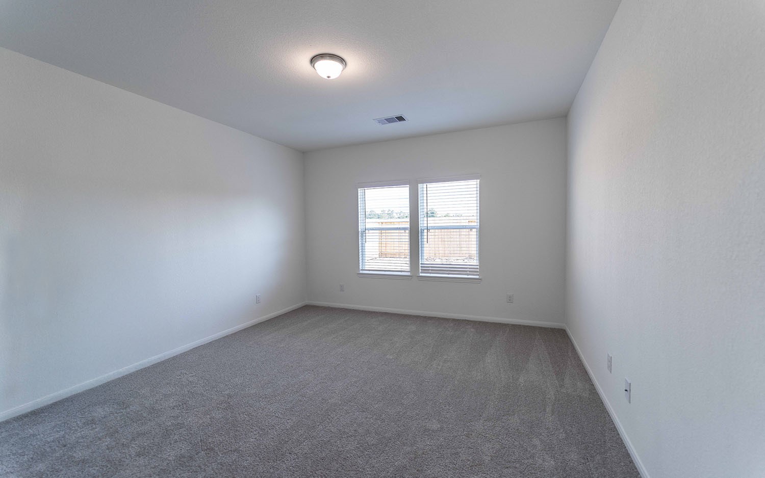 425 Monarch Trail Huntsville, TX 77340 - Photo 10 of 19 an empty room with a window