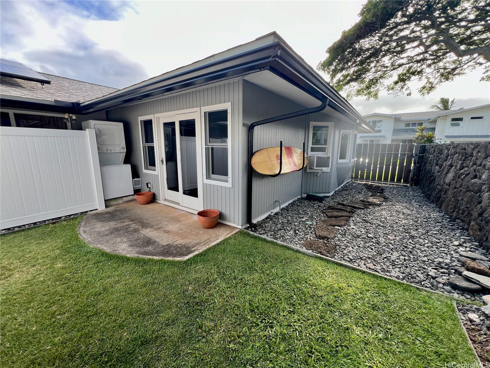 a view of a house with backyard and garden